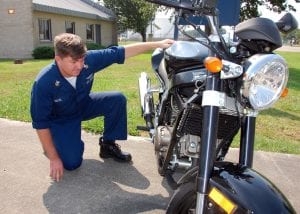 Man Inspecting used motorcycle